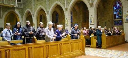 Religious renewing their vows before the offertory